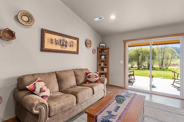 living area with visible vents, baseboards, recessed lighting, light wood-type flooring, and vaulted ceiling