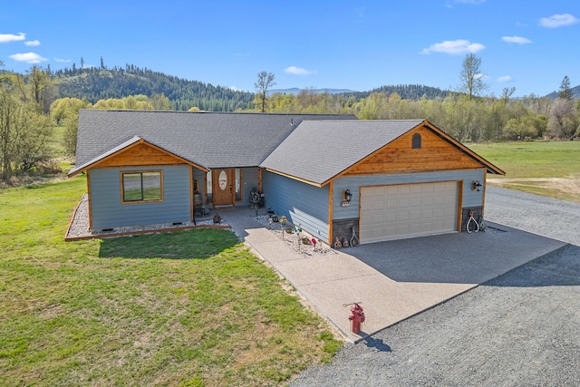 view of front of property featuring a garage, a shingled roof, concrete driveway, and a front lawn