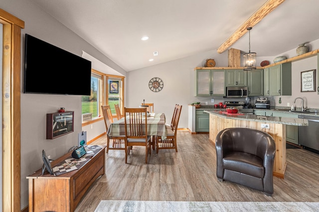 dining space with vaulted ceiling with beams, recessed lighting, light wood-style floors, and baseboards