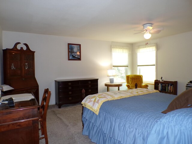 carpeted bedroom featuring a ceiling fan