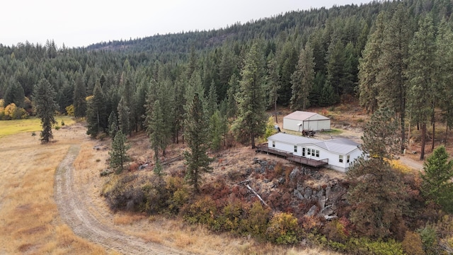 aerial view featuring a wooded view