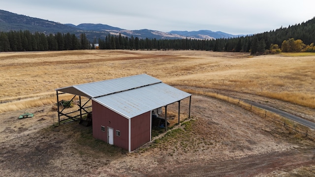 exterior space featuring a forest view and a rural view