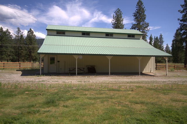 1425 Chapin Rd N, Evans, WA 99126 - back of house featuring a metal roof, an outbuilding, a carport, and a pole building