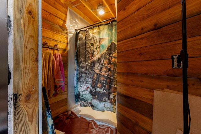 4004 N P Northport Flat Creek Rd, Northport, WA 99157 - bathroom with curtained shower and wood walls