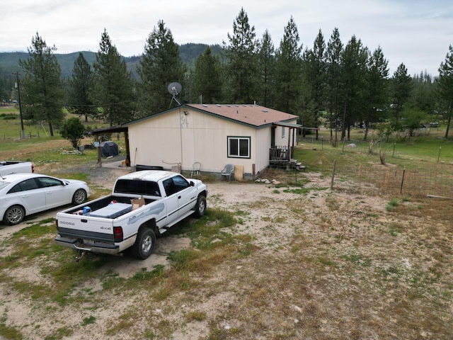 view of side of home with a mountain view