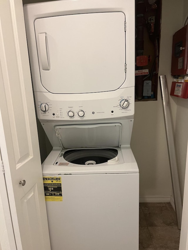 360 E 7th Ave, Colville, WA 99114 - laundry area with stacked washing machine and dryer and baseboards