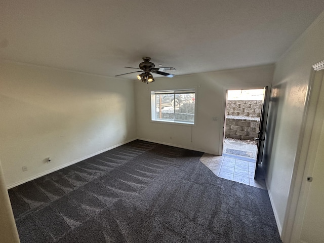 360 E 7th Ave, Colville, WA 99114 - unfurnished room featuring dark colored carpet and ceiling fan