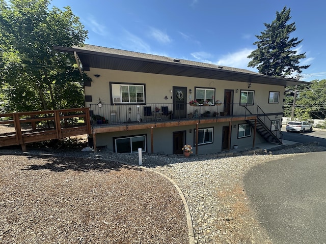 360 E 7th Ave, Colville, WA 99114 - townhome / multi-family property with stucco siding and stairs