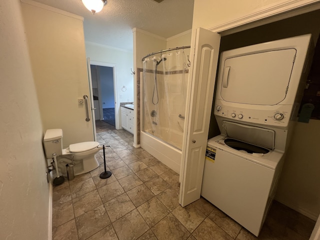 360 E 7th Ave, Colville, WA 99114 - bathroom featuring stacked washing machine and dryer, a textured ceiling, shower / tub combo with curtain, and crown molding