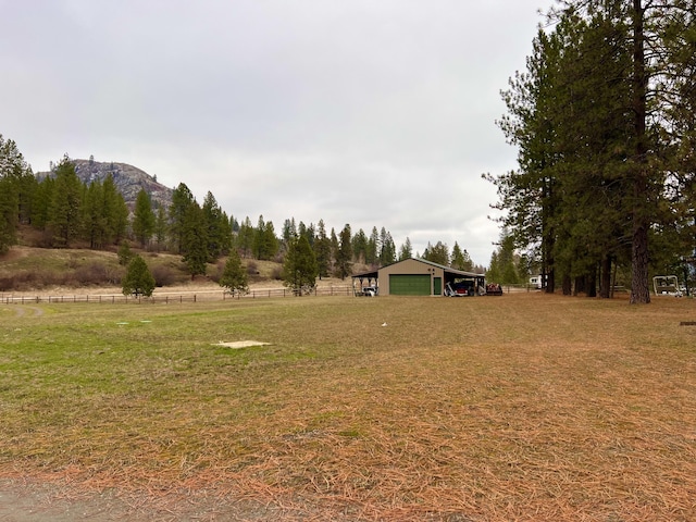 4070 Northport Flat Creek Rd, Northport, WA 99157 - view of yard with a garage, a rural view, and an outbuilding
