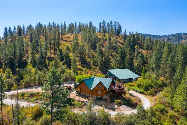 birds eye view of property with a wooded view