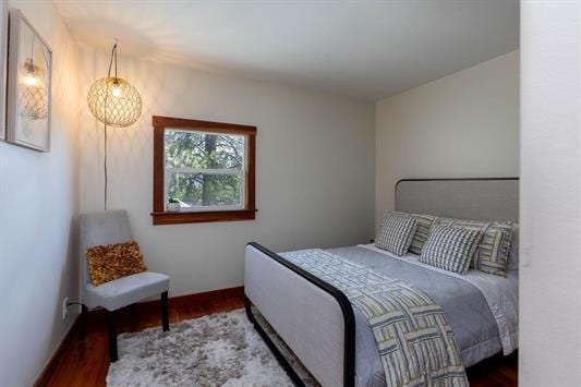 bedroom featuring wood finished floors