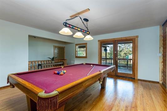 game room with french doors, billiards, baseboards, and wood finished floors