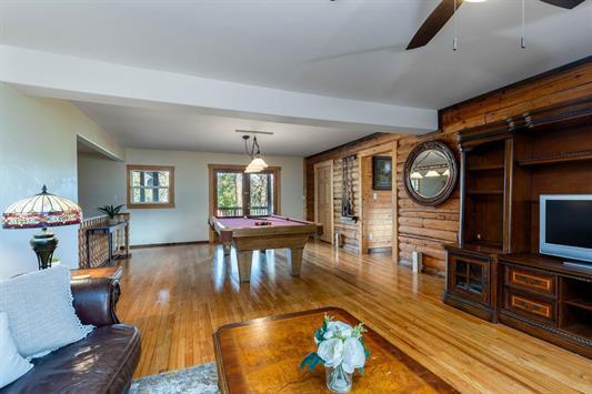 recreation room featuring rustic walls, pool table, beamed ceiling, and wood finished floors