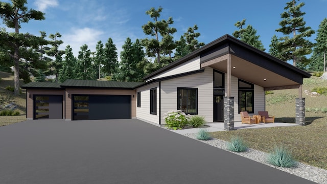 715 Palmer Ln, Chewelah, WA 99109 - view of front of house with asphalt driveway and a garage