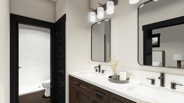 715 Palmer Ln, Chewelah, WA 99109 - bathroom featuring toilet, double vanity, and wood finished floors