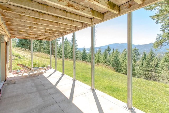 view of patio / terrace featuring a mountain view