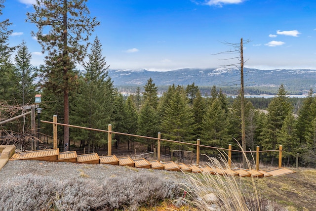 property view of mountains featuring a forest view