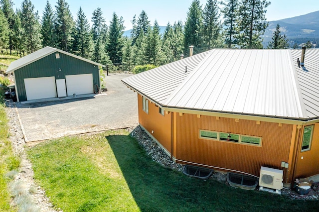 birds eye view of property featuring a mountain view