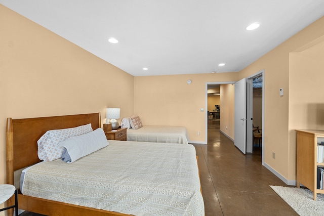 bedroom featuring finished concrete flooring, baseboards, and recessed lighting