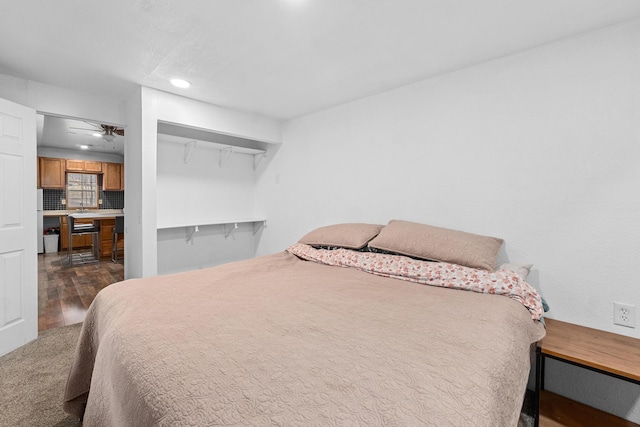 bedroom featuring dark hardwood / wood-style flooring and a closet