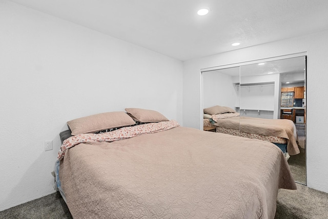 bedroom with a closet and carpet flooring