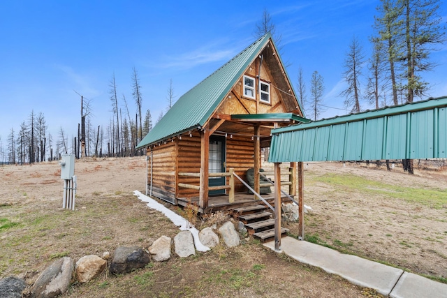 log home with an outdoor structure