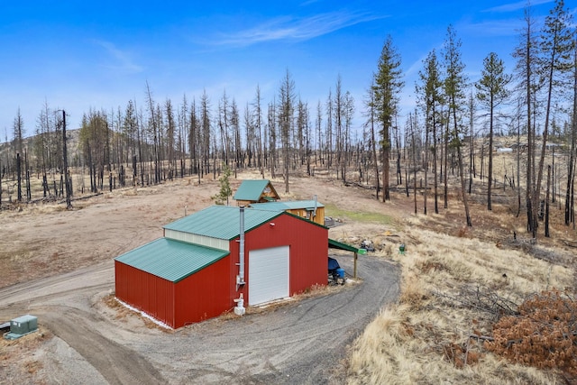 view of outbuilding featuring a garage and a rural view