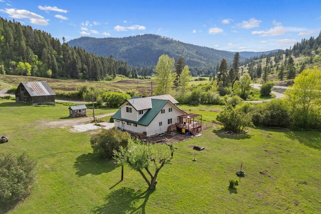 3063 Hungry Hill Rd, Kettle Falls, WA 99141 - overview of rural landscape featuring a mountainous background and a heavily wooded area