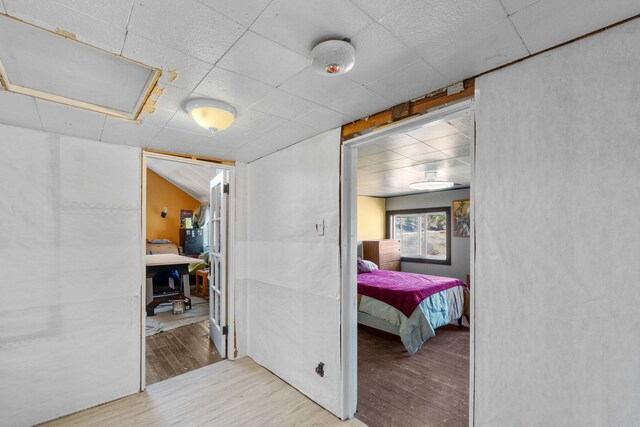 3063 Hungry Hill Rd, Kettle Falls, WA 99141 - hallway with wood finished floors, a drop ceiling, and an office area