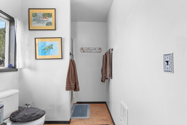 3063 Hungry Hill Rd, Kettle Falls, WA 99141 - full bath with toilet, wood finished floors, and a shower