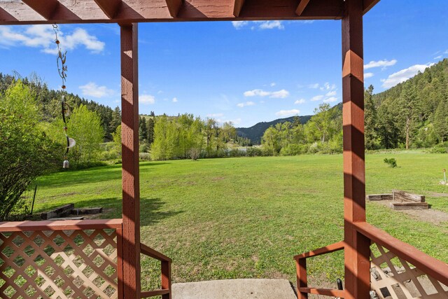 3063 Hungry Hill Rd, Kettle Falls, WA 99141 - view of green lawn with a mountain view and a wooded view