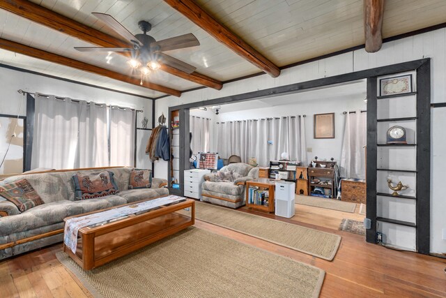 3063 Hungry Hill Rd, Kettle Falls, WA 99141 - living room with hardwood / wood-style flooring, a ceiling fan, beam ceiling, and wooden ceiling
