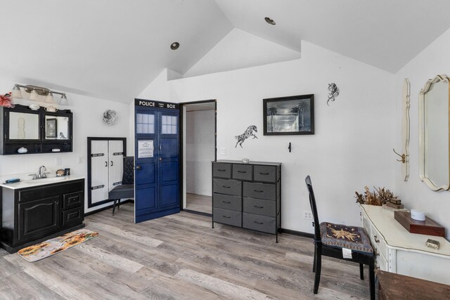 3063 Hungry Hill Rd, Kettle Falls, WA 99141 - bedroom with lofted ceiling, light wood-type flooring, and a sink