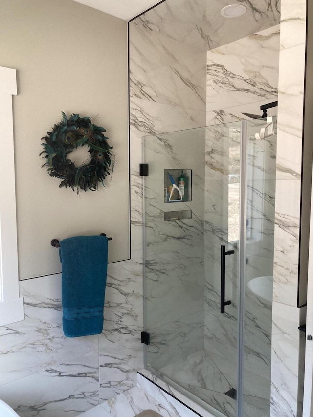 full bathroom with a marble finish shower