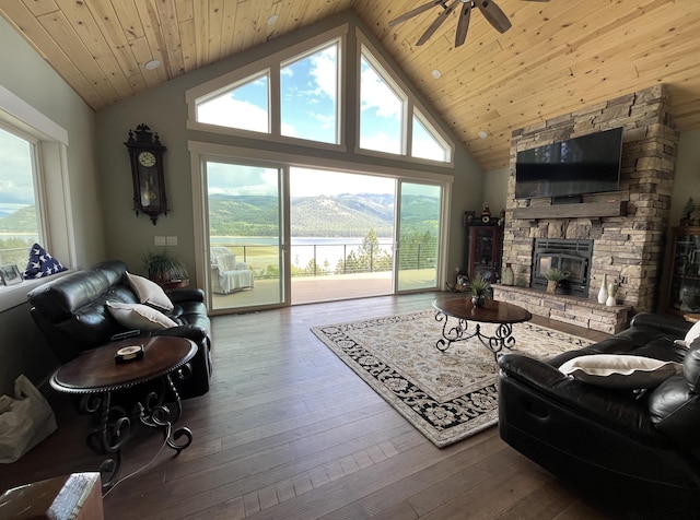 living room featuring ceiling fan, healthy amount of natural light, hardwood / wood-style flooring, wooden ceiling, and high vaulted ceiling
