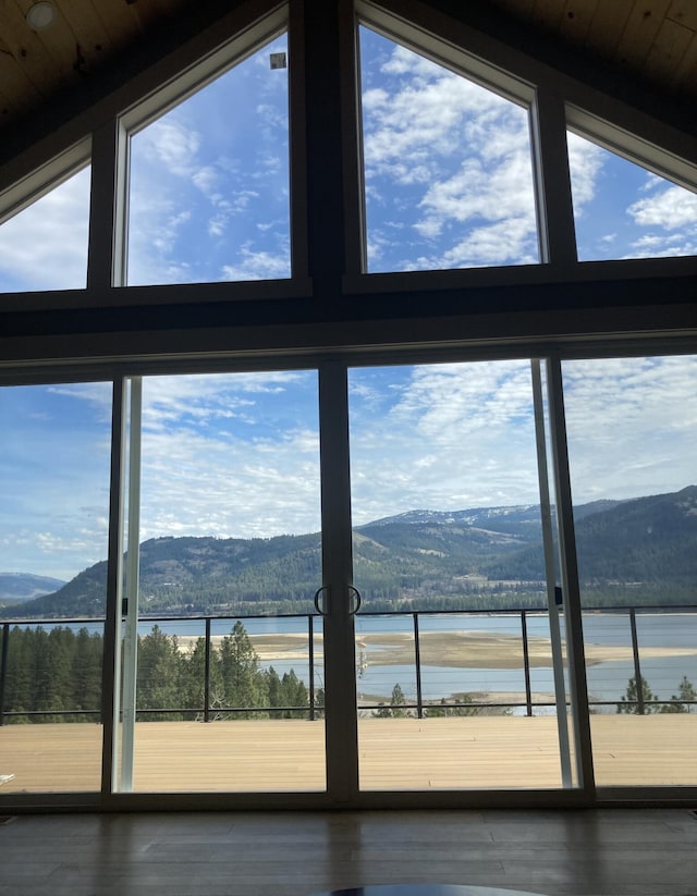 detailed view of a water and mountain view and wood finished floors