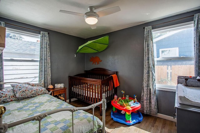 bedroom featuring wood-type flooring and ceiling fan