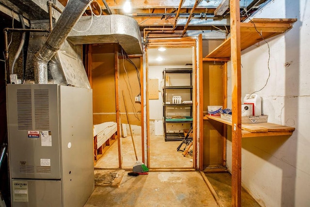 utility room featuring heating unit