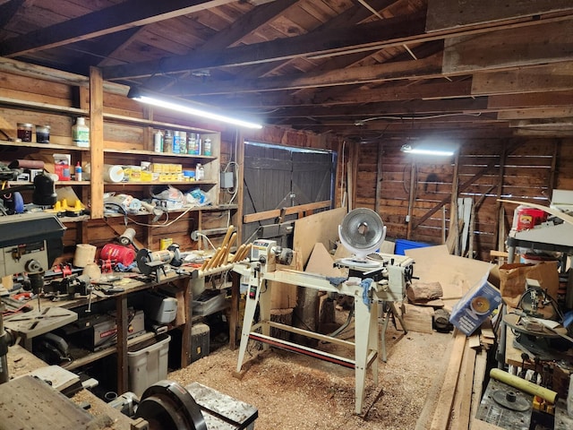 misc room featuring wooden ceiling and a workshop area