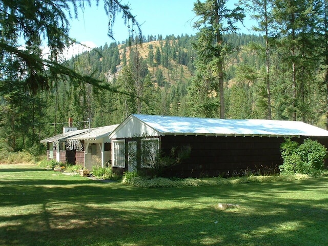 view of home's exterior featuring a yard