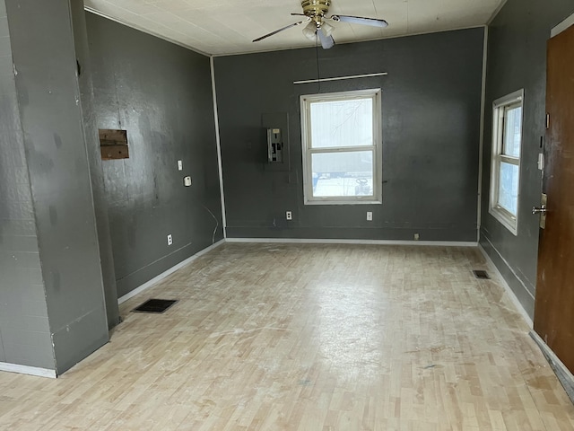 530 Kalmia St, Kettle Falls, WA 99141 - unfurnished room with light hardwood / wood-style floors, electric panel, and ceiling fan