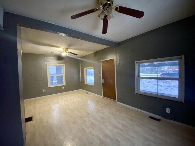 530 Kalmia St, Kettle Falls, WA 99141 - spare room with ceiling fan, hardwood / wood-style flooring, and vaulted ceiling with beams