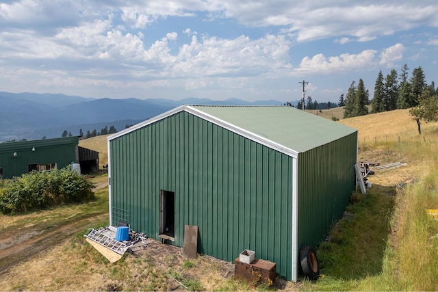view of pole building featuring a mountain view