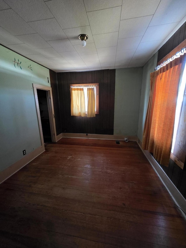 707 N 4th St W, Chewelah, WA 99109 - empty room with wood finished floors and wooden walls