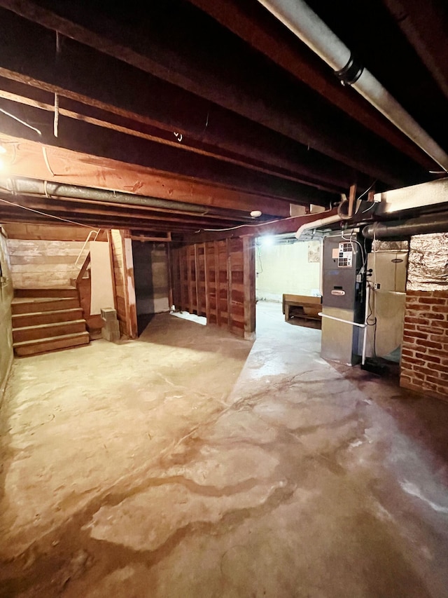 707 N 4th St W, Chewelah, WA 99109 - unfinished below grade area featuring stairway and heating unit
