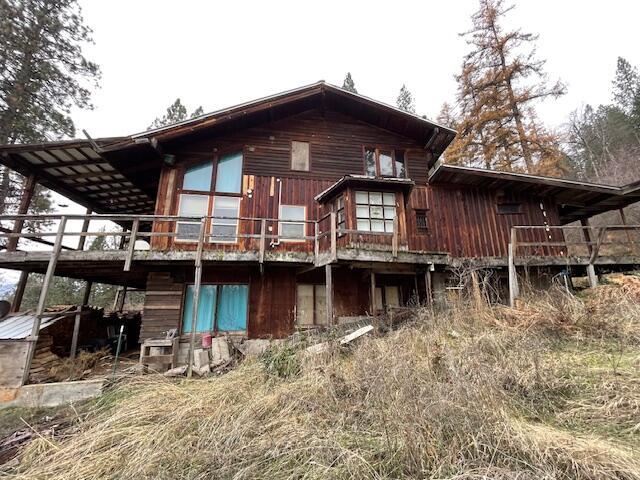 rear view of house with a wooden deck