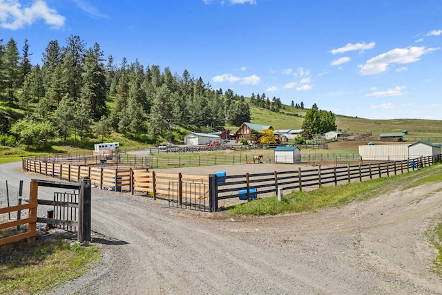 1427 Chapin Rd N, Evans, WA 99126 - view of dirt / gravel driveway featuring an outdoor riding arena, a rural view, and a gated entry