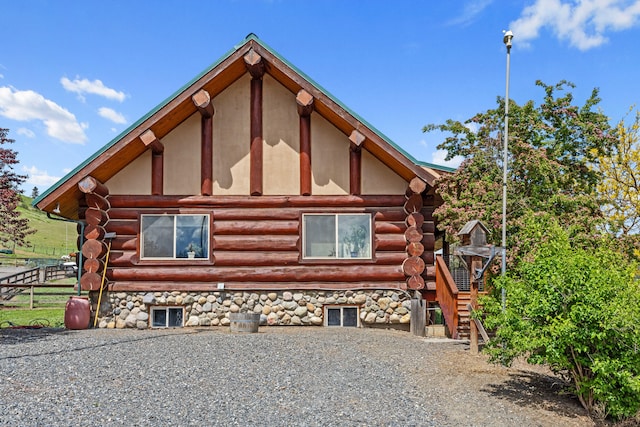 1427 Chapin Rd N, Evans, WA 99126 - view of home's exterior featuring log siding and stairs