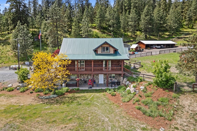 1427 Chapin Rd N, Evans, WA 99126 - rear view of house with metal roof, a patio, an outdoor structure, log exterior, and an exterior structure